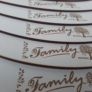 May include: A stack of white coasters with a brown border and the word "Family" in cursive script. The coasters feature a stylized tree design and the word "Restaurant" in Cyrillic script.