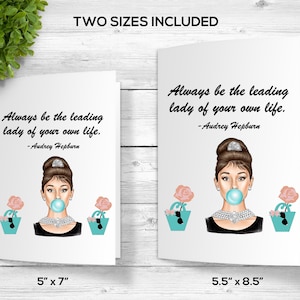 May include: Two printable greeting cards featuring a stylized illustration of Audrey Hepburn with a bubblegum, wearing a pearl necklace and a black dress. The text on the card reads "Always be the leading lady of your own life. -Audrey Hepburn". The cards are available in two sizes: 5 inches by 7 inches and 5.5 inches by 8.5 inches.