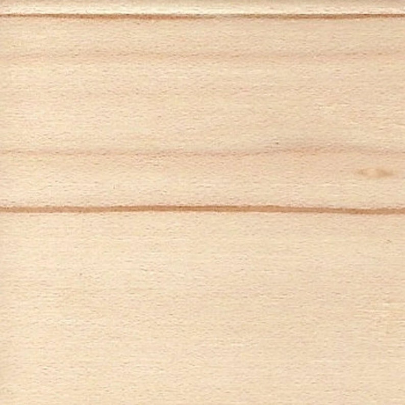 May include: A close-up of a light wood surface with a natural grain pattern. The wood has a smooth, even texture.