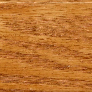 May include: A close-up of a wood grain surface with a light brown color and a natural wood finish.
