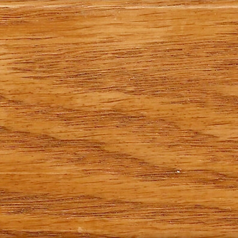 May include: A close-up of a wood grain surface with a light brown color and a natural wood finish.