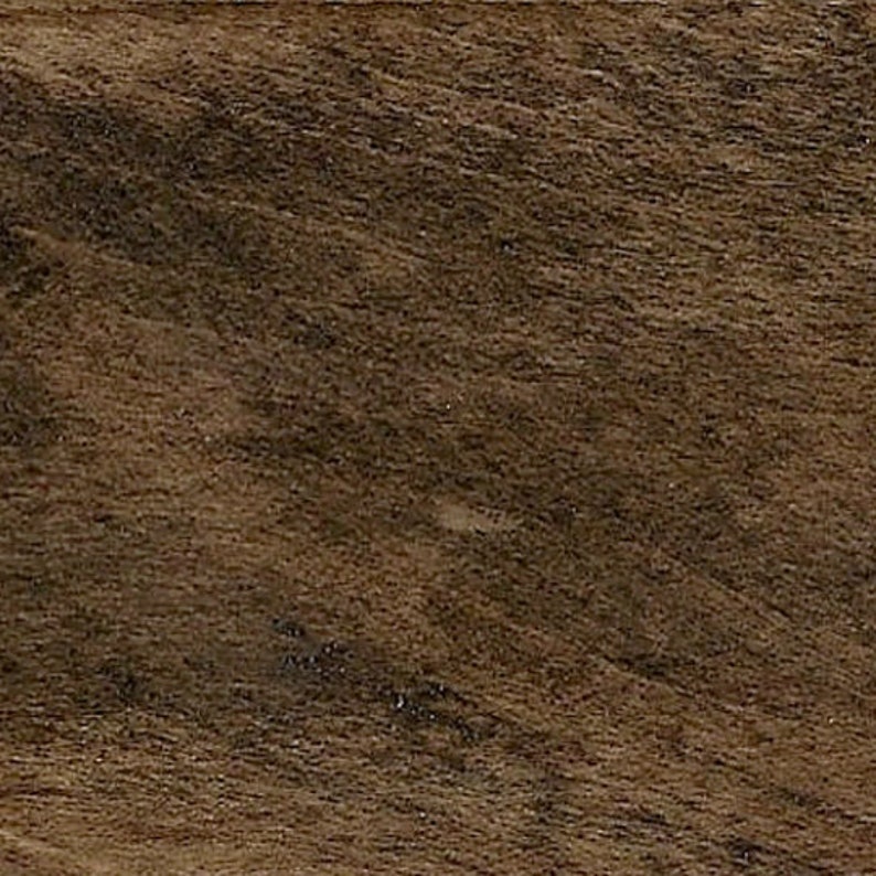 May include: A close-up of a dark brown wood grain surface.