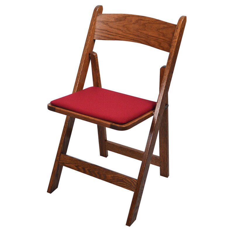 May include: A wooden folding chair with a red padded seat. The chair is made of dark wood and has a simple design.