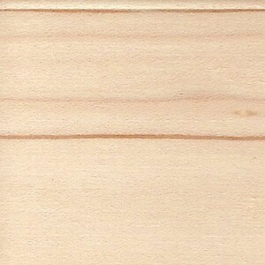 May include: A close-up of a light wood surface with a natural grain pattern. The wood has a smooth, even texture.