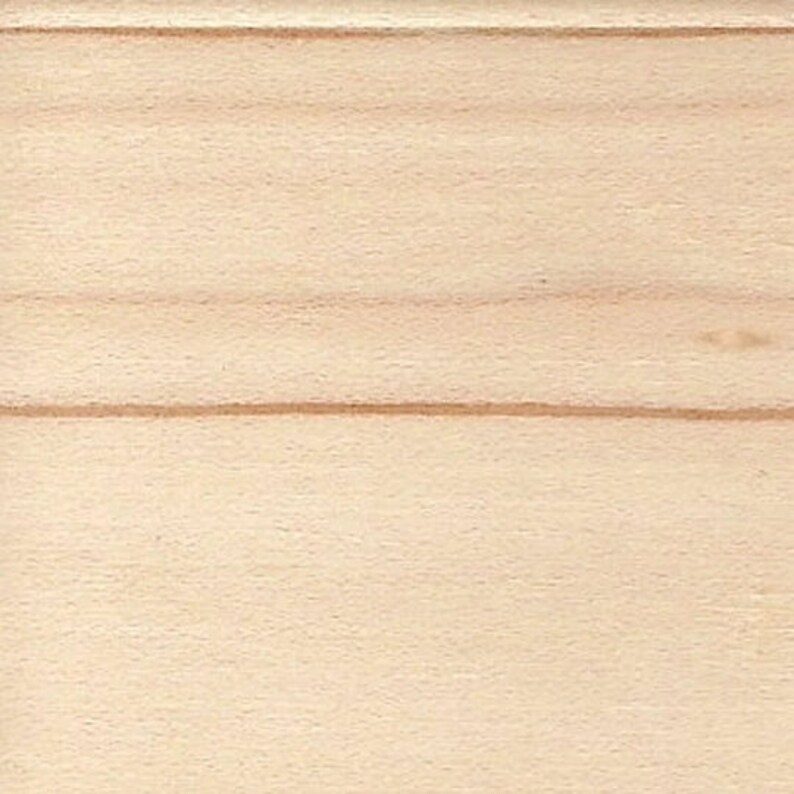 May include: A close-up of a light wood surface with a natural grain pattern. The wood has a smooth, even texture.