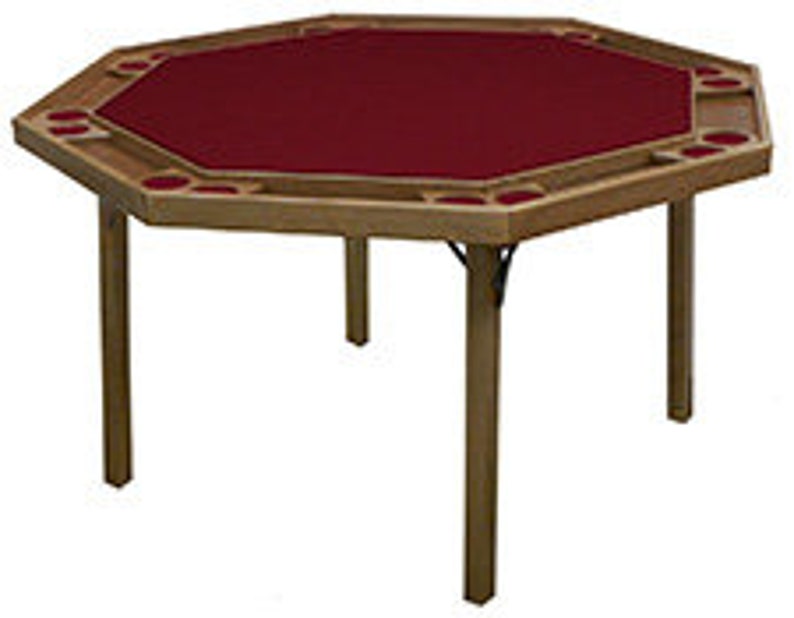 May include: A wooden octagonal folding table with a red felt top and cup holders around the edge. The table is ideal for playing cards or other games.