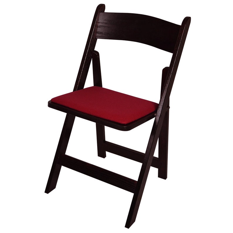 May include: A black folding chair with a red padded seat. The chair is made of wood and has a simple design.
