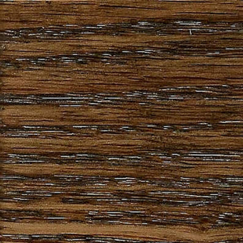 May include: Close-up of a dark brown wood grain surface. The wood has a natural, rustic look with a smooth, polished finish.