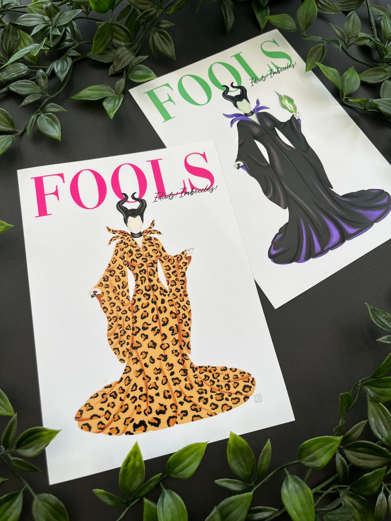 May include: Two printable art prints featuring the Disney villain Maleficent. The first print features Maleficent in a black and purple gown with a green staff. The second print features Maleficent in a leopard print gown. Both prints have the word "FOOLS" in large letters at the top and the text "Fools - Imbeciles!" below the image.