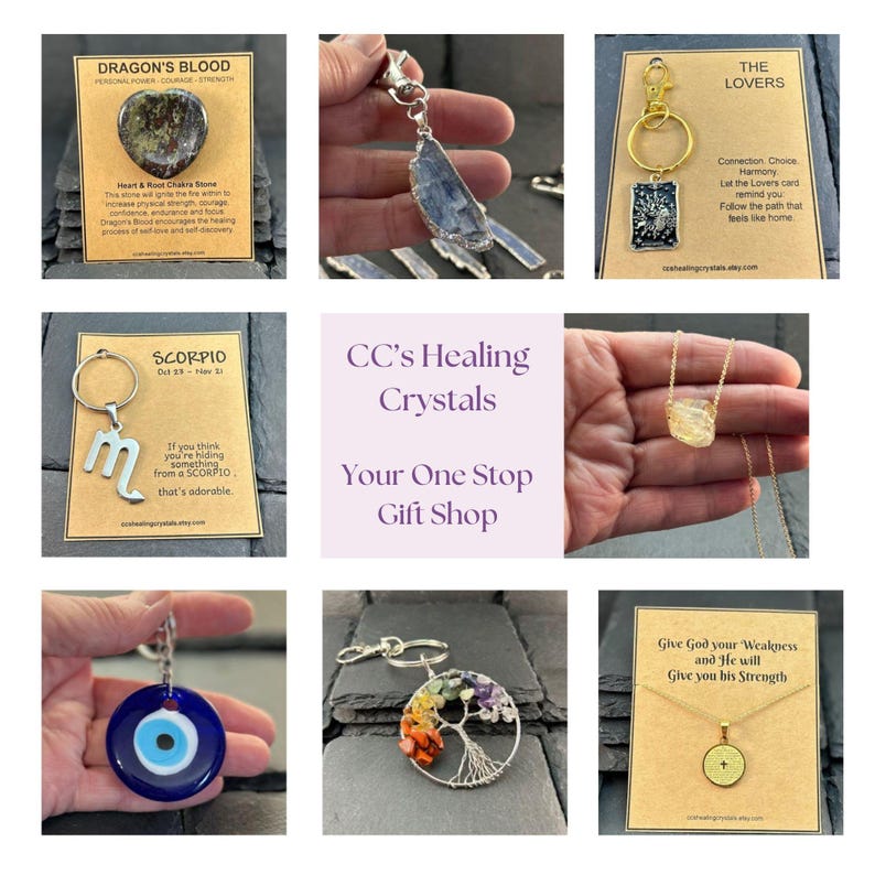 May include: A collage of various jewelry items including a Dragon's Blood stone, a blue crystal pendant, a The Lovers tarot card keychain, a Scorpio symbol keychain, a yellow crystal necklace, a blue evil eye charm, a tree of life keychain, and a cross necklace.