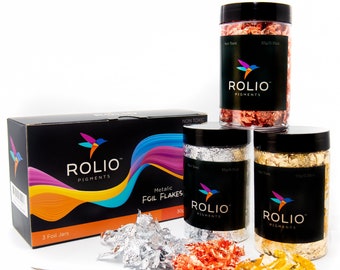 May include: A collection of Rolio Pigments metallic foil flakes in silver, copper, and gold. The set includes three jars, a box, and a pair of tweezers. The jars are labeled with the brand name and product details. The box reads "Metallic Foil Flakes".