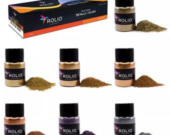 May include: Set of seven small jars of mica powder in metallic colors. The jars are labeled "Rolio Pigments" and the colors are gold, copper, bronze, purple, silver, and gray.