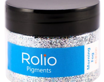 May include: A jar of silver glitter labelled "Rolio Pigments Morning Fog #18100".