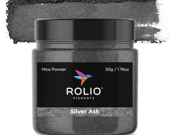 May include: A black jar of Silver Ash mica powder, labeled "Rolio Pigments" with a hummingbird logo. The jar contains 50g / 1.76oz of powder.