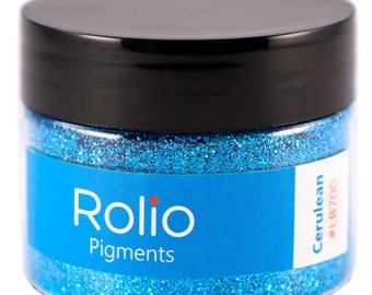 May include: A jar of blue glitter labelled "Rolio Pigments Cerulean #LB700"