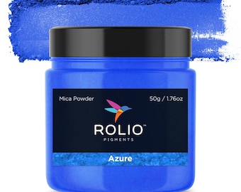 May include: A round jar of blue mica powder labeled "Rolio Pigments Azure" with a hummingbird logo and the text "Mica Powder 50g / 1.76oz".