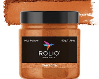May include: A jar of Terracitta mica powder, a vibrant orange color, with a hummingbird logo and the text "ROLIO PIGMENTS" on the label. The jar is 50g / 1.76oz.