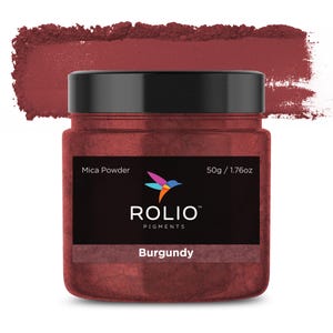 May include: A 1.76 ounce jar of Burgundy mica powder. The jar is labeled "Rolio Pigments" and features a hummingbird logo. Mica powder is a natural mineral used in cosmetics and crafts.