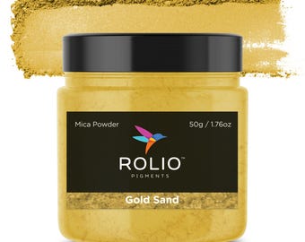 May include: A 1.76 ounce jar of Gold Sand mica powder. The jar is black with a white label that says "ROLIO PIGMENTS" and "Gold Sand".