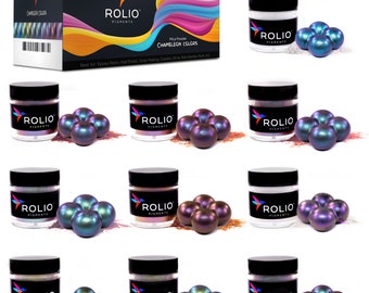 May include: Twelve jars of mica powder pigments in various chameleon colors. Each jar has a black lid and a white label with the word "ROLIO" and "PIGMENTS" printed on it. Each jar is surrounded by four small iridescent spheres.