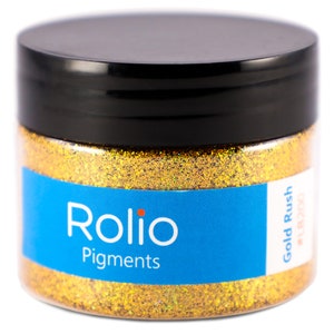May include: A jar of gold glitter labeled "Rolio Pigments Gold Rush #BZ00".