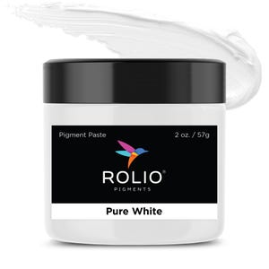 May include: A white pigment paste in a round jar with a black lid. The jar has a label with the text "Pigment Paste", "2 oz. / 57g", "ROLIO® PIGMENTS", and "Pure White".