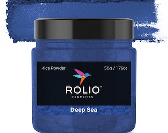 May include: A round jar of deep blue mica powder with a black lid. The label reads "Mica Powder", "Rolio Pigments", and "Deep Sea". The jar contains 50g / 1.76oz of powder.