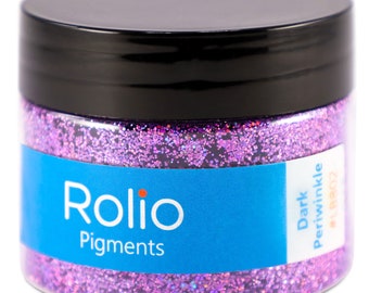 May include: A jar of dark periwinkle glitter by Rolio Pigments. The jar is filled with fine, iridescent glitter.