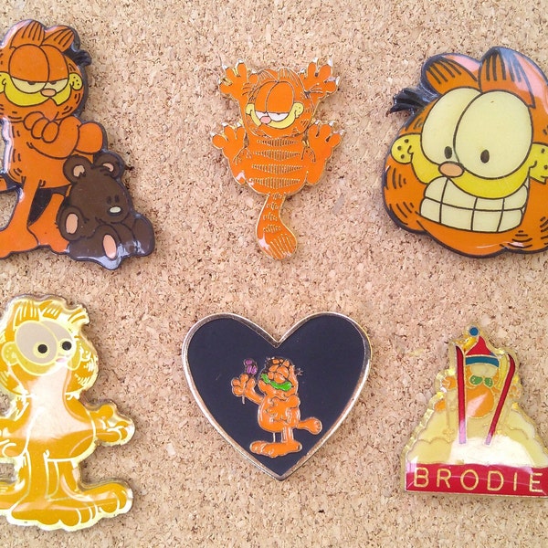 Vintage Garfield the cat pins: Garfield and Pooky, skiiing Garfield, Garfield heart and other Garfield enamel pins