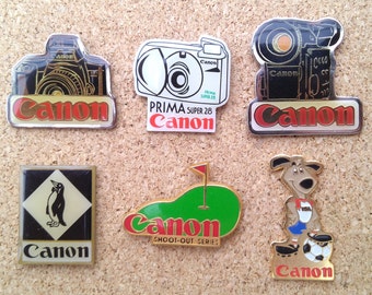 Vintage Canon camera pins: video camera, Prima Super 28, penguin, shoot-out series & USA '94 enamel pins