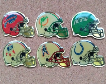 Vintage NFL (AFC East & South) football helmet enamel pins: Buffalo Bills, Miami Dolphins, New York Jets, Patriots, Houston Oilers and Colts