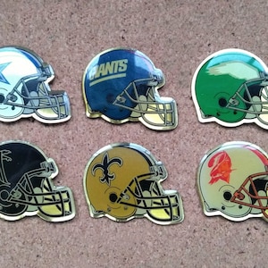 Vintage NFL (NFC East & South) football helmet enamel pins: Dallas Cowboys, New York Giants, Eagles, Atlanta Falcons, Saints and Buccaneers