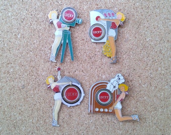 Vintage Lucky Strike cigarettes pin-up girl pins: Camera, jackpot, drums & jukebox pin-up girl enamel pins