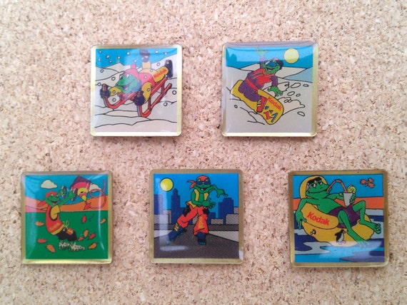 Vintage Kodak frog pins: sledding, snowboarding, kite flying, rollerskating and pool Kodak frog enamel pins