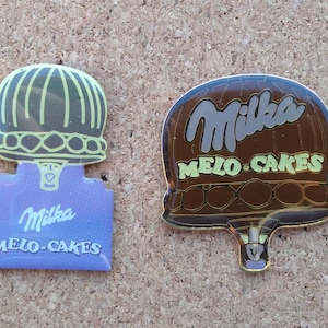 Vintage Milka Melo-Cakes (chocolate-coated marshmallow treats) air balloon enamel pins