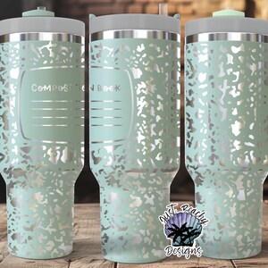 May include: A mint green travel mug with a silver speckled pattern and a matching handle. The mug has a silver rim and lid, with the words "Composition Book" printed on the front. The mug is designed to keep beverages hot or cold.