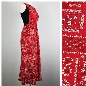 May include: A red maxi dress with a bandana print. The dress has a sleeveless bodice and a tie at the back.