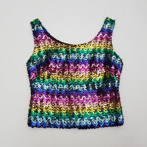 May include: A rainbow sequined tank top with a scoop neck and a sleeveless design.