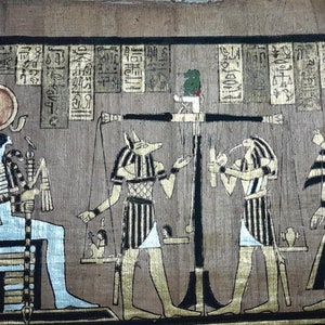 May include: An ancient Egyptian papyrus painting depicting the weighing of the heart ceremony. The scene shows the god Anubis weighing the heart of a deceased person against a feather, while the god Thoth records the results. The deceased person is shown standing before the god Osiris, who will judge their fate in the afterlife.