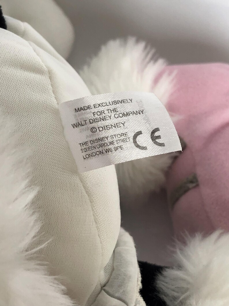 May include: White and pink plush toy with a white fur trim. The toy has a tag that reads "Made Exclusively for the Walt Disney Company &copy;Disney The Disney Store 3 Queen Caroline Street London W6 9PE CE".