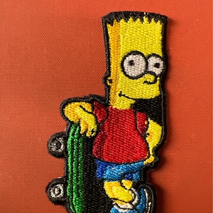 May include: Yellow cartoon character with spiky hair holding a green skateboard. The character is wearing a red shirt, blue shorts, and white shoes.