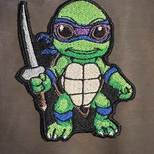 turtle holding sword iron on patch