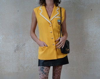 Vintage 80s exceptional blazer sleeveless size. 38/40 M/L yellow with college patch, white piping, unique college look vest
