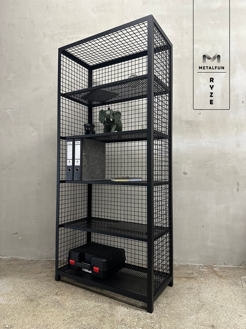 May include: Black metal wireframe bookshelf with multiple shelves. The shelves hold decorative items, binders, and a black case. The bookshelf has a rectangular shape and is against a neutral-colored wall. The brand name "METALFUN" is visible.