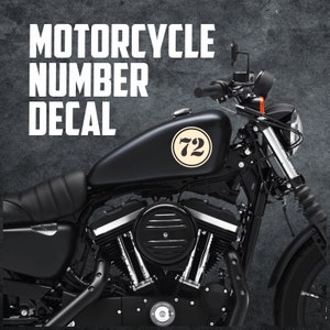May include: Black motorcycle with a white number 72 decal on the gas tank.  Motorcycle number decal.