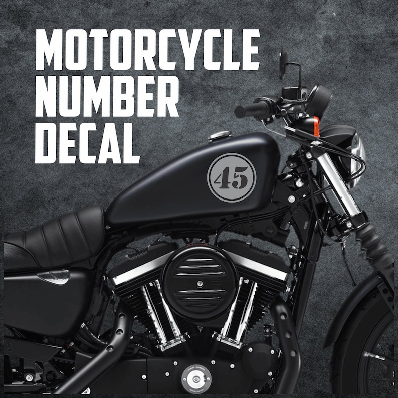 May include: Black motorcycle with a number 45 decal on the gas tank.  Motorcycle number decal.