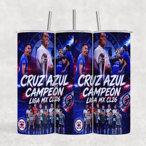May include: A set of three stainless steel tumblers with lids and straws. The tumblers feature a blue design with the words "CRUZ AZUL CAMPEON LIGA MX CL26" and images of soccer players and a trophy.