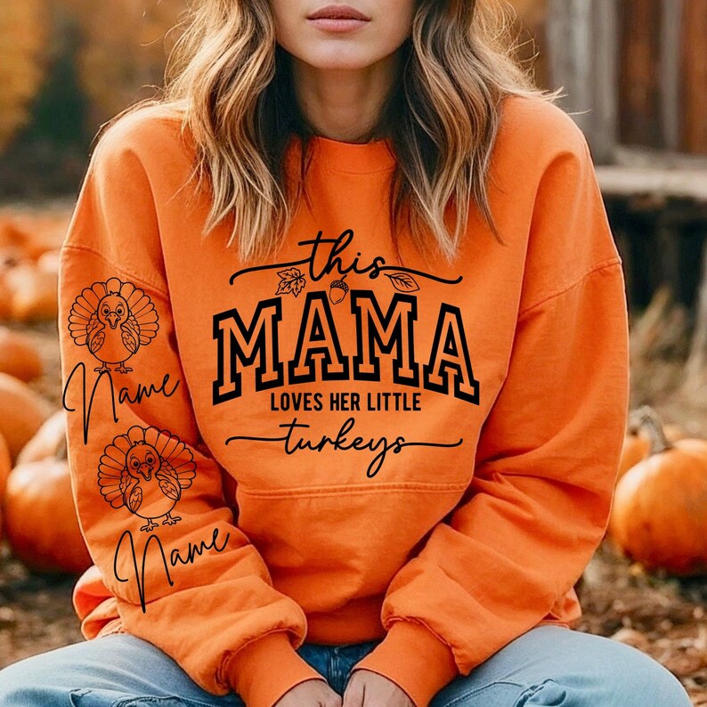 May include: Orange sweatshirt with the text "This Mama Loves Her Little Turkeys" and two turkeys on the sleeves. The text is in black and the turkeys are outlined in black.