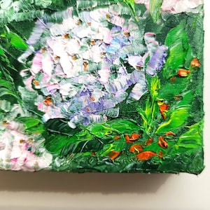 May include: Close-up of an oil painting depicting a cluster of white and purple flowers with green leaves. The flowers are painted with thick, textured strokes, giving the painting a three-dimensional effect.