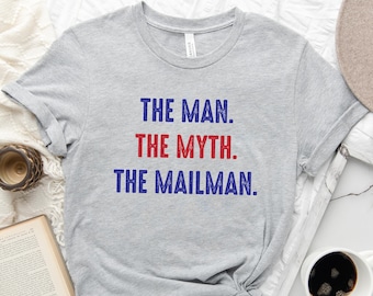 May include: Gray t-shirt with the text "THE MAN. THE MYTH. THE MAILMAN." in blue and red lettering.